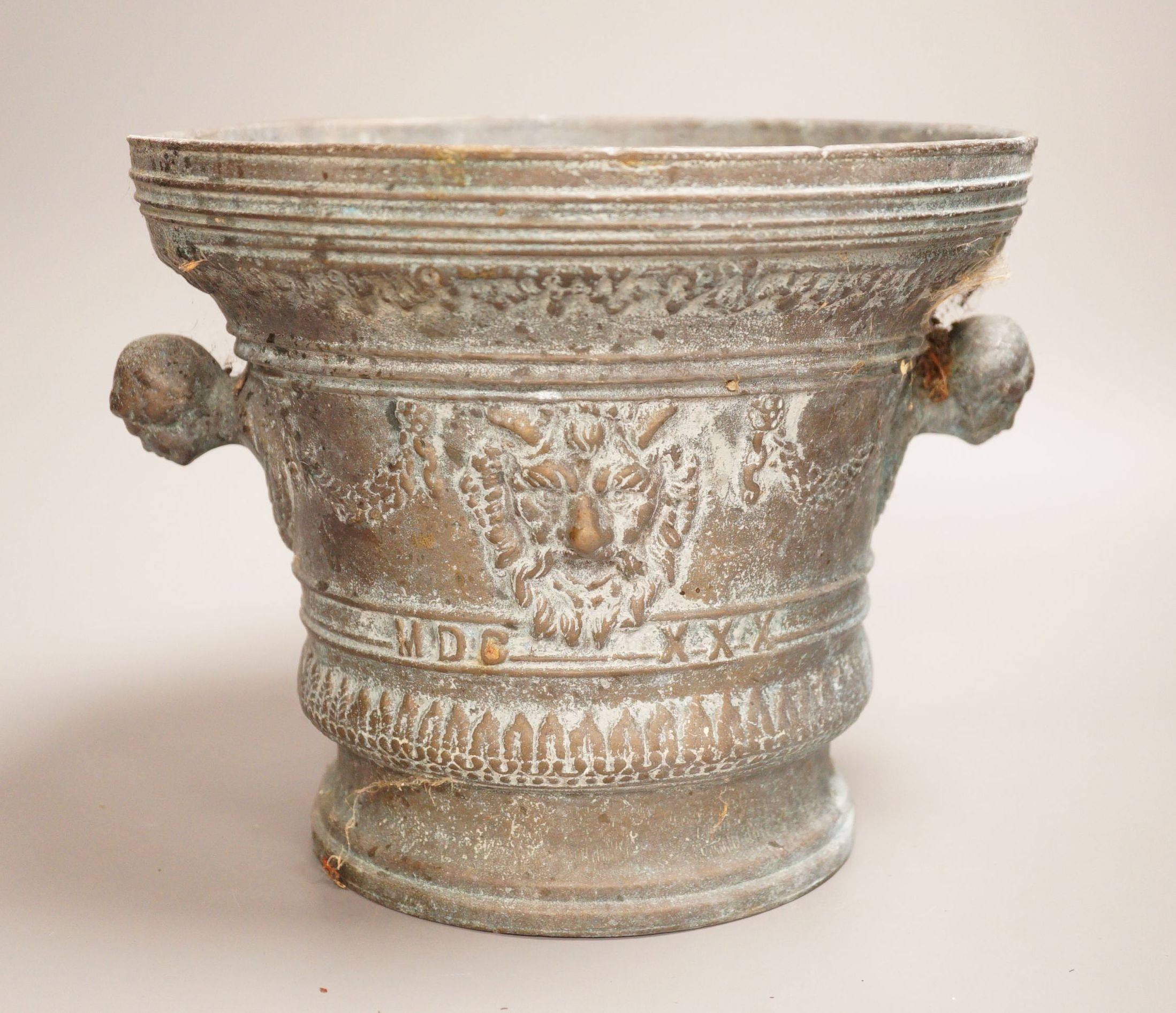 A bronze mortar, dated 1630, 21cm